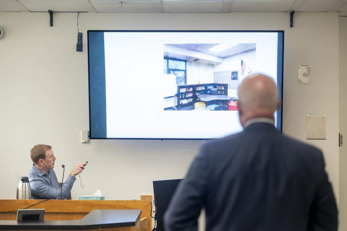 Jordan Henderson, a former teacher at Evergreen Elementary School, is asked to point out areas of his former classroom during his time on the stand on Monday, Dec. 29, 2025, at Pierce County Superior Court in Tacoma, Wash. Henderson, 36, has been charged with 12 counts of first-degree child molestation.