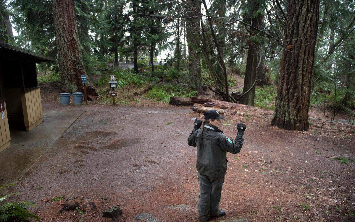 Park Ranger Shawn Douty stands in the day-use area at Kopachuck State Park in Gig Harbor, Washington, on Thursday, Jan. 6, 2022. This area will be redesigned with a visitors center, playground and amphitheater as part of a $9 million park renovation, the first major changes since the state park was built, Douty said.