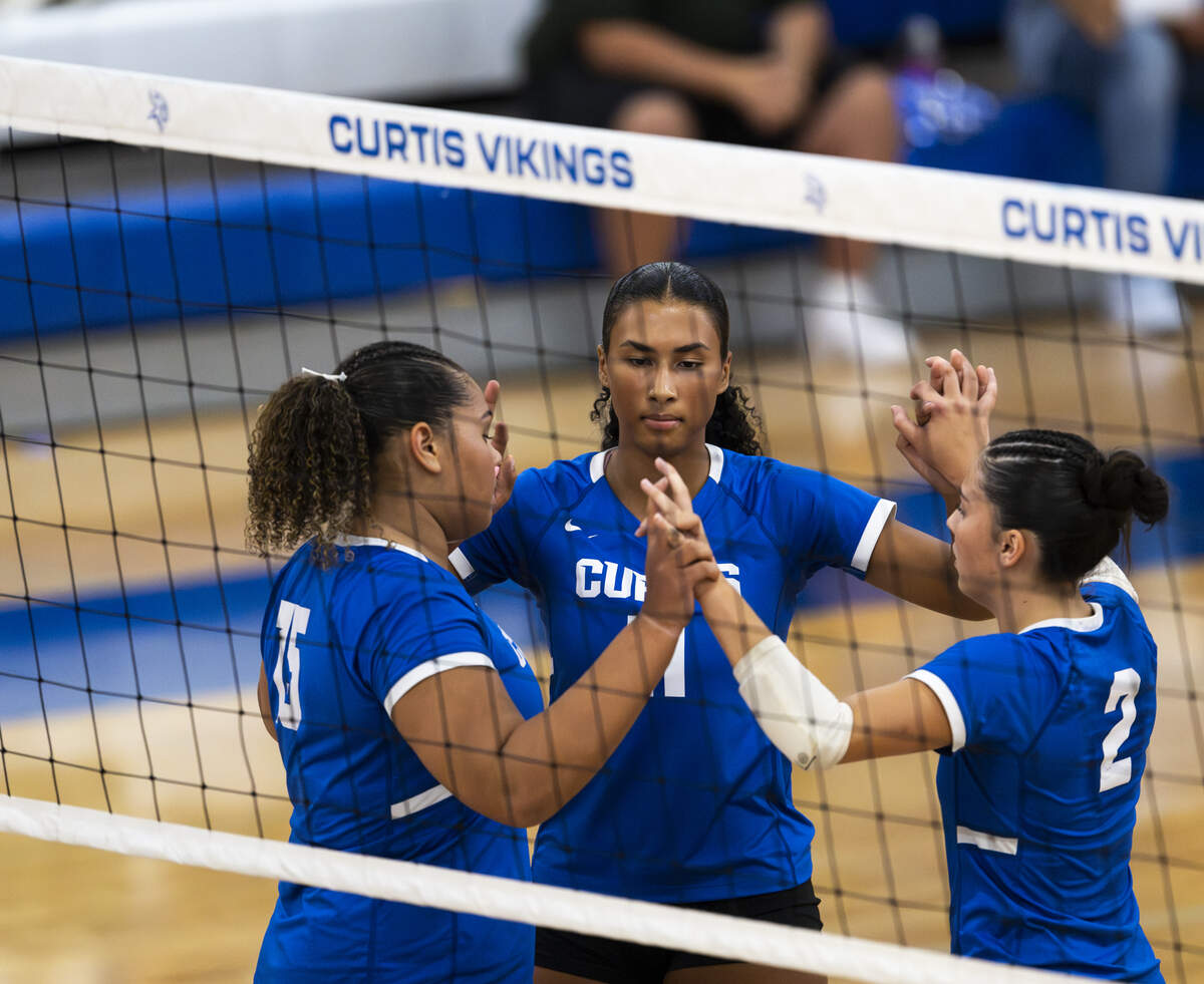 Curtis Vikings celebrates a point against the Kennedy Catholic Lancers during the volleyball match at Curtis Senior High School, on Thursday, Sept. 18, 2025, in University Place, Wash.