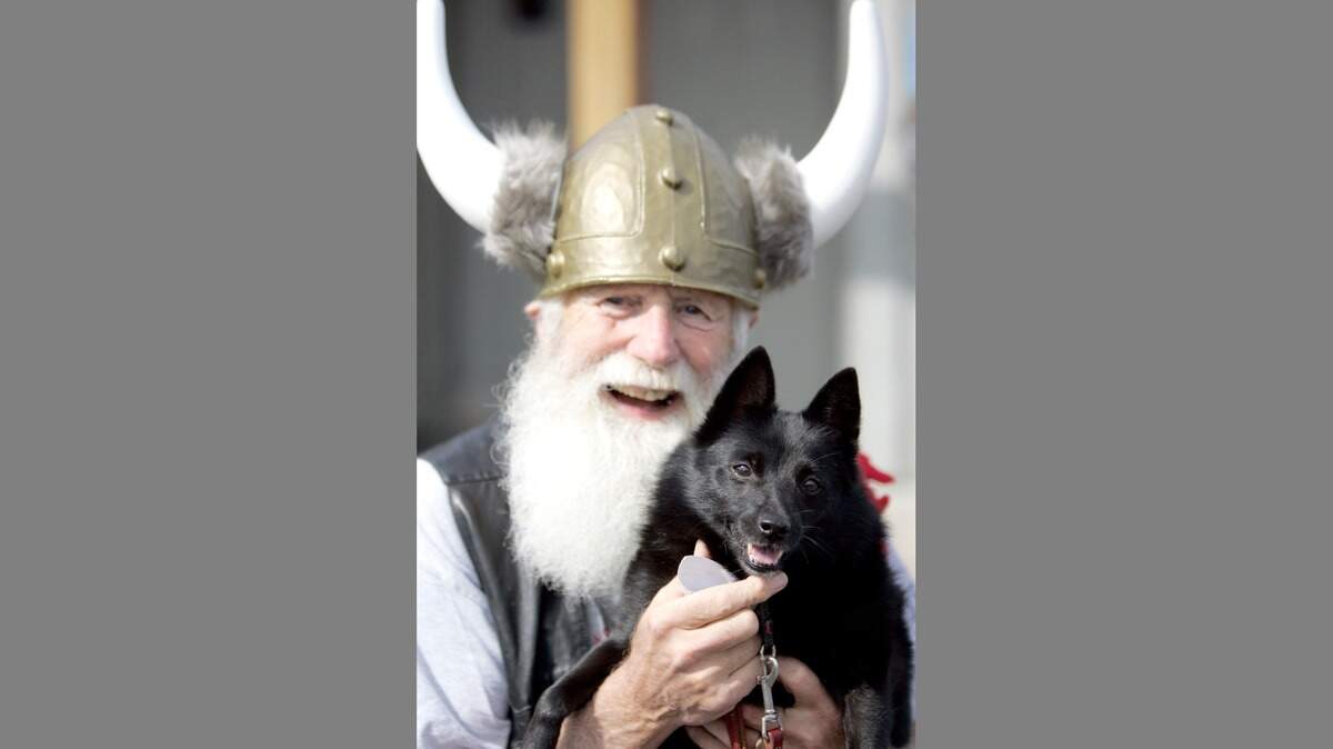 Jim O’Donnell, seen here in 2012 at a Saturday Harbor Hounds event with his pup Lady Bug, died recently. He is being remembered for his activism and good nature.