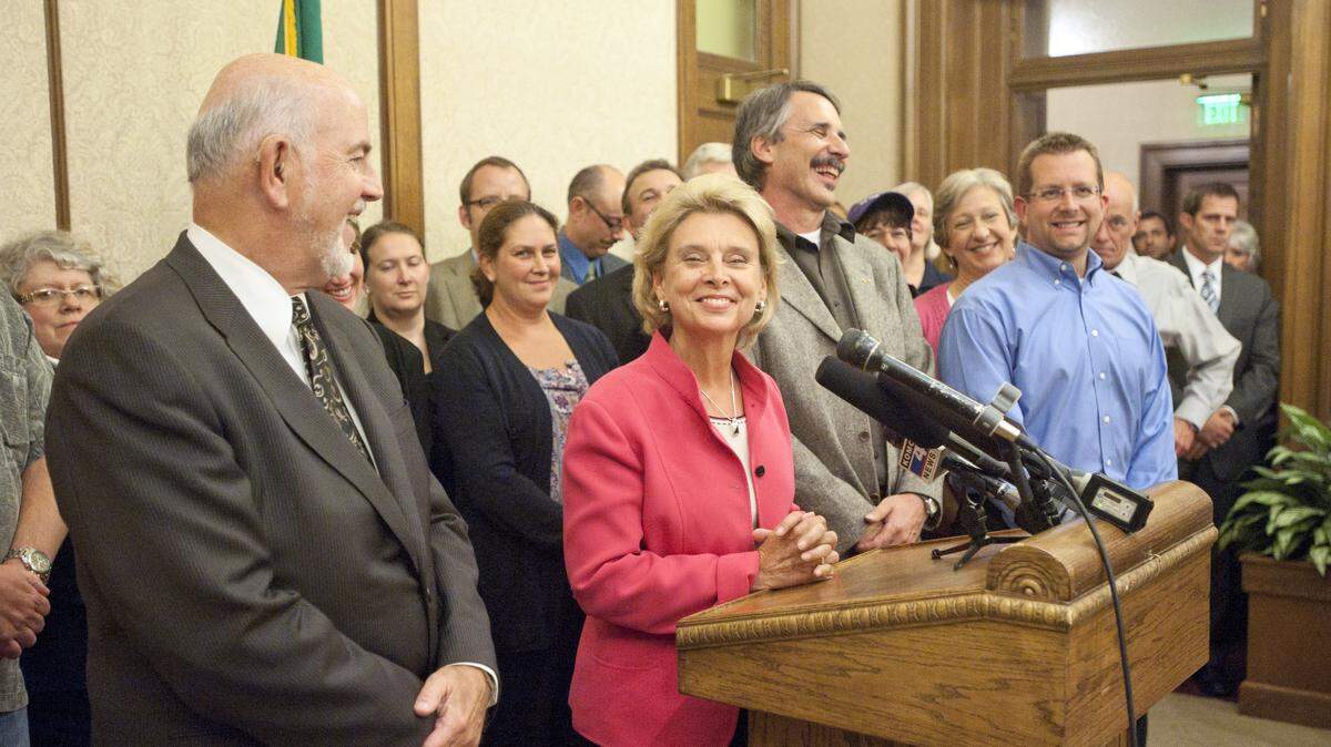 Gov. Chris Gregoire chuckles along with the negotiating teams representing Tacoma Public Schools and Tacoma teachers after seven hours of negotiations in the governor’s office on Sept. 21, 2011. Time will tell if Gov. Jay Inslee gets involved with the current wave of teacher strikes in a similar way.