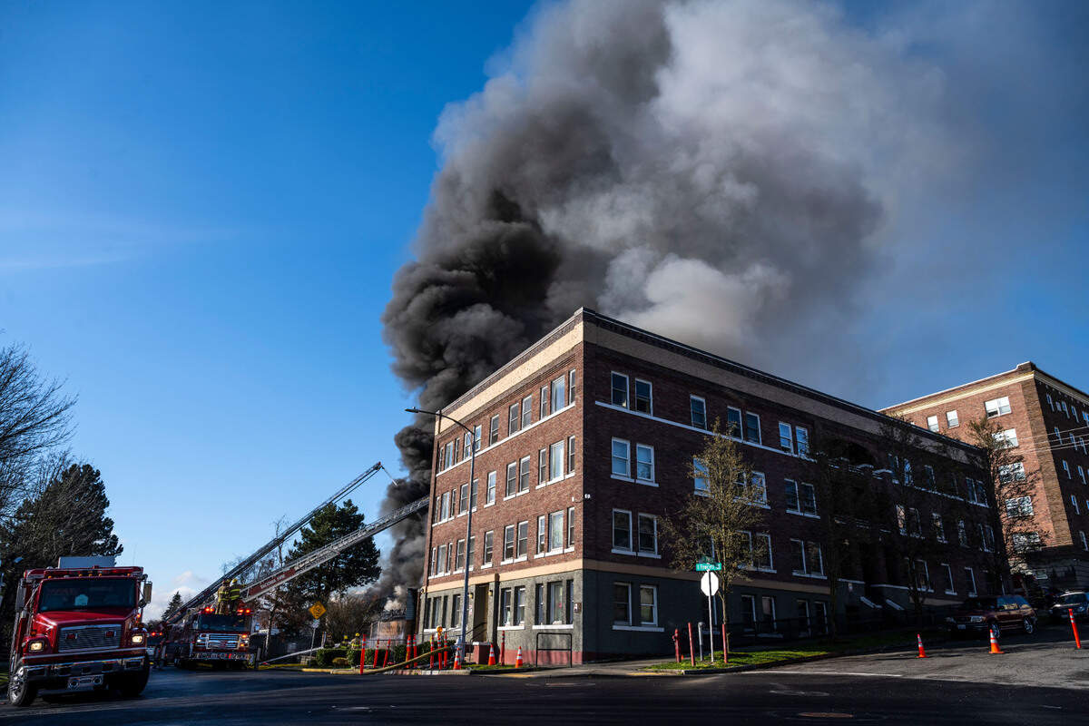 Tacoma firefighters battle a large commercial building fire at the 700 block of Fawcett Avenue in Tacoma, Wash. on March 21, 2023. Tacoma Fire Department spokesperson Joe Meinecke said no injuries have been reported, but crews aren’t sure whether anyone was inside when the fire started. He said the building is supposed to be vacant.