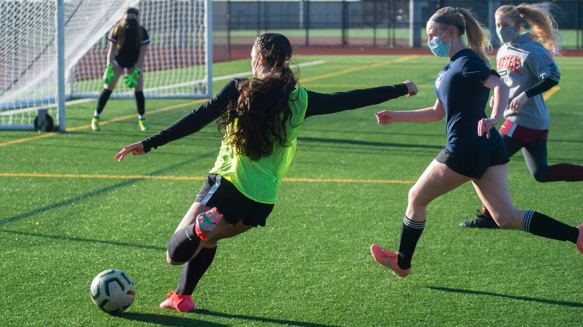 Auburn Riverside forward Samiah Shell takes a shot on goal during a recent practice in Auburn on Wednesday, March 10, 2021. In her freshman season, Shell scored 17 goals and had 27 assists, leading the Ravens to the Class 4A state championship game.