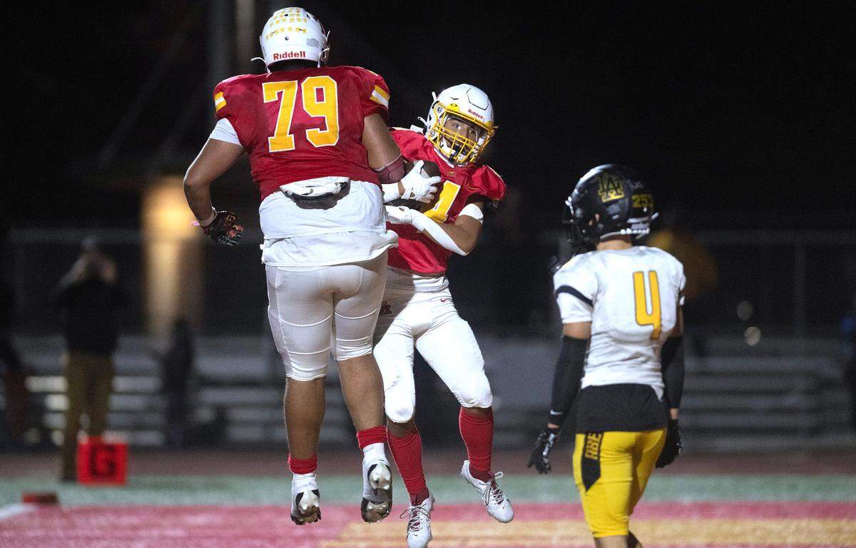 Mount Tahoma wide receiver Anthony Quintanilla Jr. celebrates his game-winning touchdown with teammate Marquise Thorpe-Taylor (79) late in Friday night’s football game against the Lincoln Abes at Mount Tahoma High School in Tacoma, Washington, on Sept. 20, 2023. Mount Tahoma won the game, 24-20.