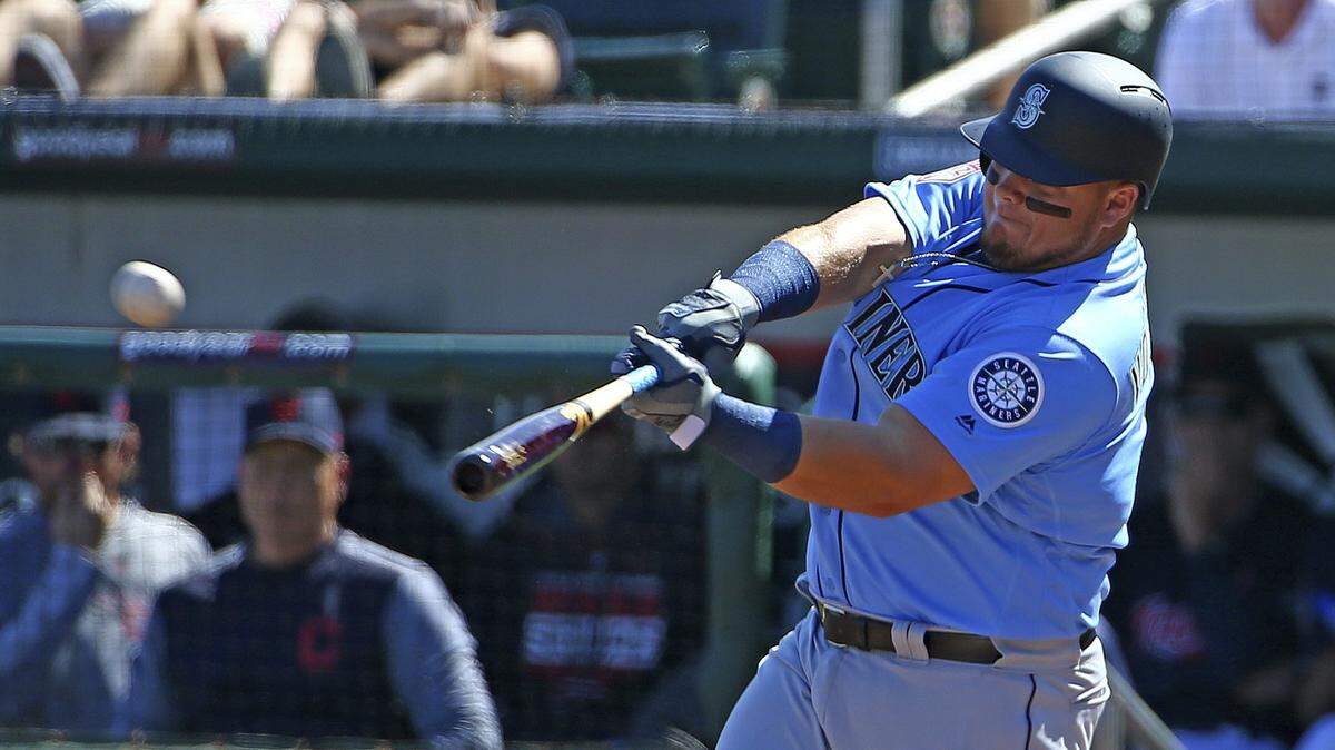 Seattle Mariners first baseman Daniel Vogelbach connects for a home run against the Cleveland Indians during the second inning of a spring training baseball game Wednesday, Feb. 27, 2019, in Goodyear, Ariz. (AP Photo/Ross D. Franklin)
