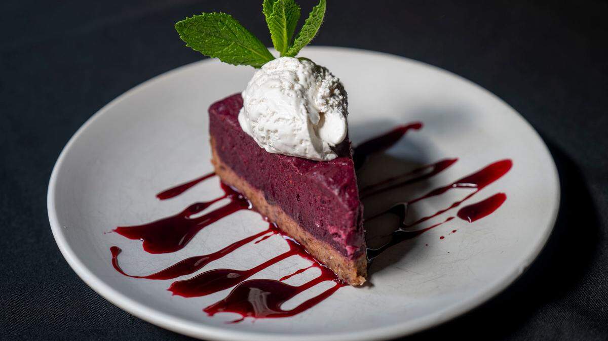 Described as “not quite a cheesecake and not quite a pie,” the berry dessert at Tacoma’s Over the Moon Cafe features a date crust and mixed berry, coconut butter and raw honey filling. Served cold, each slice is served with a port berry sauce, whipped coconut cream and mint.
