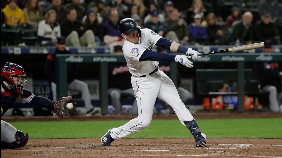 Seattle Mariners’ Ryon Healy strikes out swinging with two men on base in the fifth inning of a baseball game against the Cleveland Indians, Monday, April 15, 2019, in Seattle. (AP Photo/Ted S. Warren)