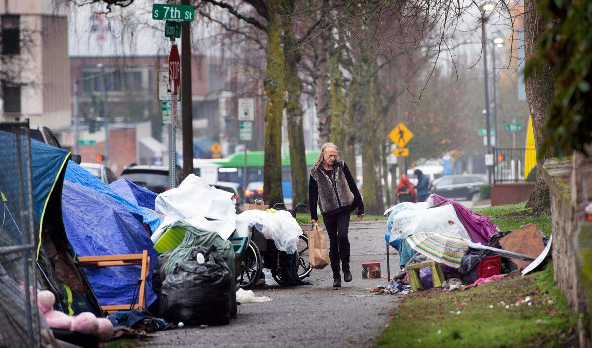 Safety concerns around a growing homeless encampment at Seventh Street and Tacoma Avenue, shown on Tuesday, Dec. 7, 2021, have prompted the owners of the nearby Cider & Cedar Taproom to move to new location in downtown Tacoma, Washington.