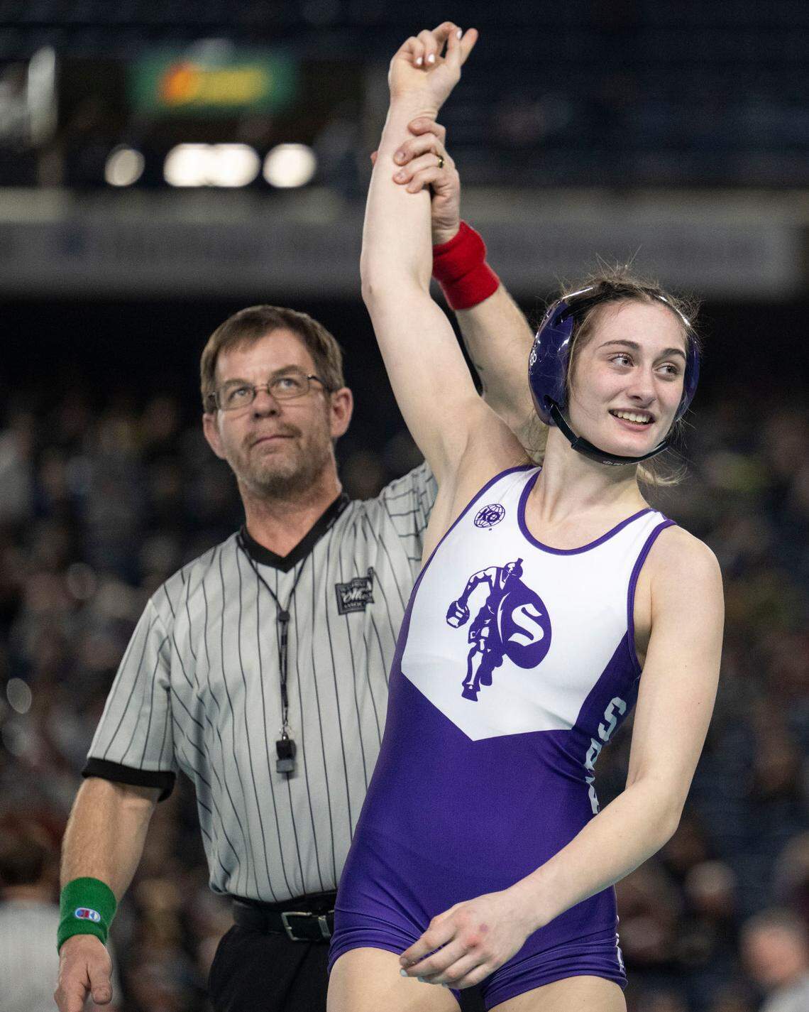 Sumner’s Saige McCleery celebrates after beating Rogers’ Lindy Strowbridge to win the Class 4A, 130-pound championship on Friday, Feb. 21, 2025, at Mat Classic XXXVI at the Tacoma Dome in Tacoma, Wash.