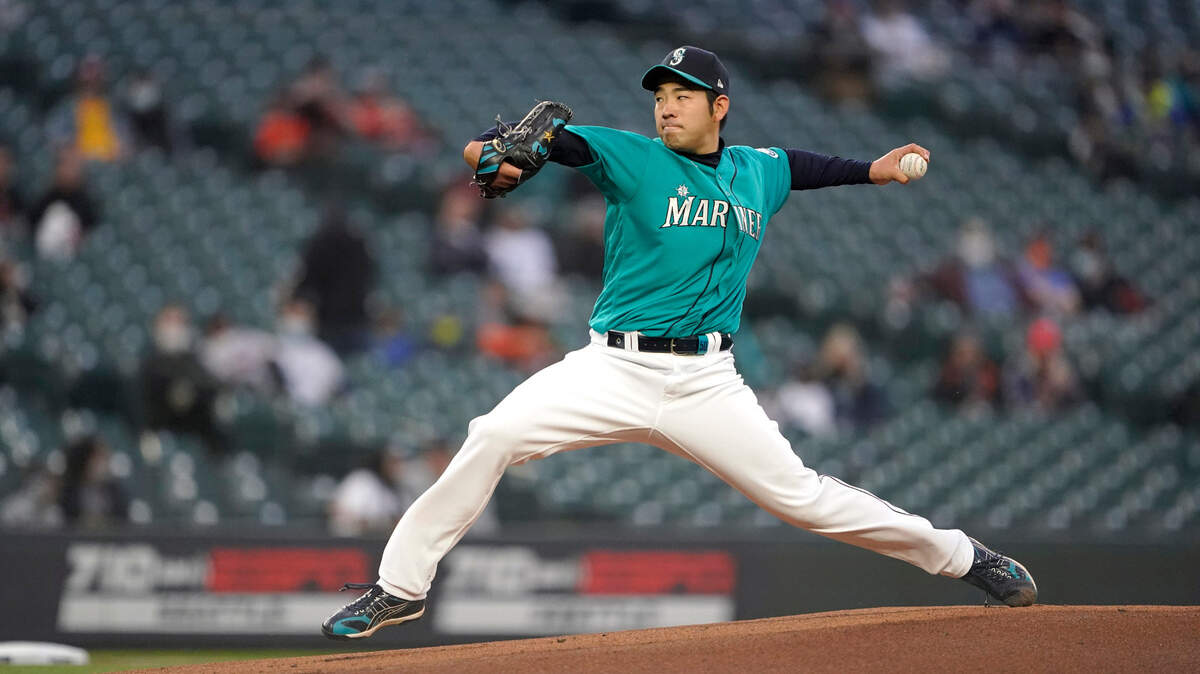 Seattle Mariners starting pitcher Yusei Kikuchi throws to a San Francisco Giants batter during the first inning of a baseball game Friday, April 2, 2021, in Seattle. (AP Photo/Ted S. Warren)