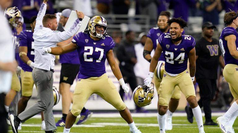 Huskies top Bears in overtime, 31-24