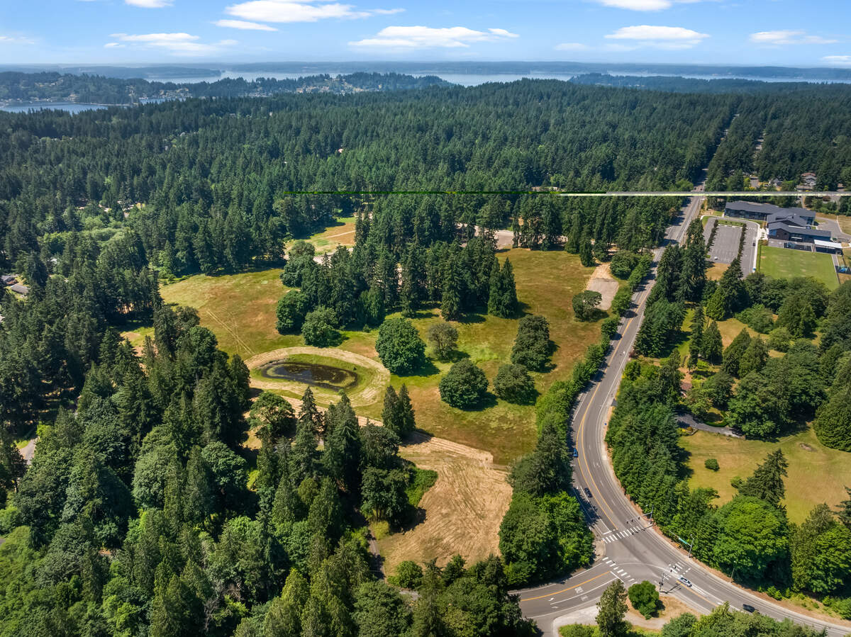 An overhead view of the Graham Ranch housing development site, near the intersection of 40th Street Northwest and Wollochet Drive and located across from Artondale Elementary School, near Gig Harbor, Wash. The developer will leave 19 acres preserved as open space.