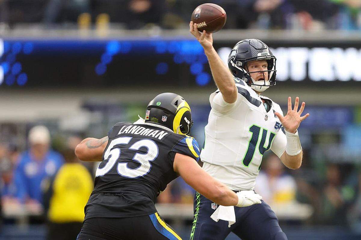Seattle Seahawks quarterback Sam Darnold (14) passes the ball under pressure from Los Angeles Rams linebacker Nate Landman (53) during the second quarter at SoFi Stadium on November 16, 2025 in Inglewood, California. (Photo by Sean M. Haffey/Getty Images)