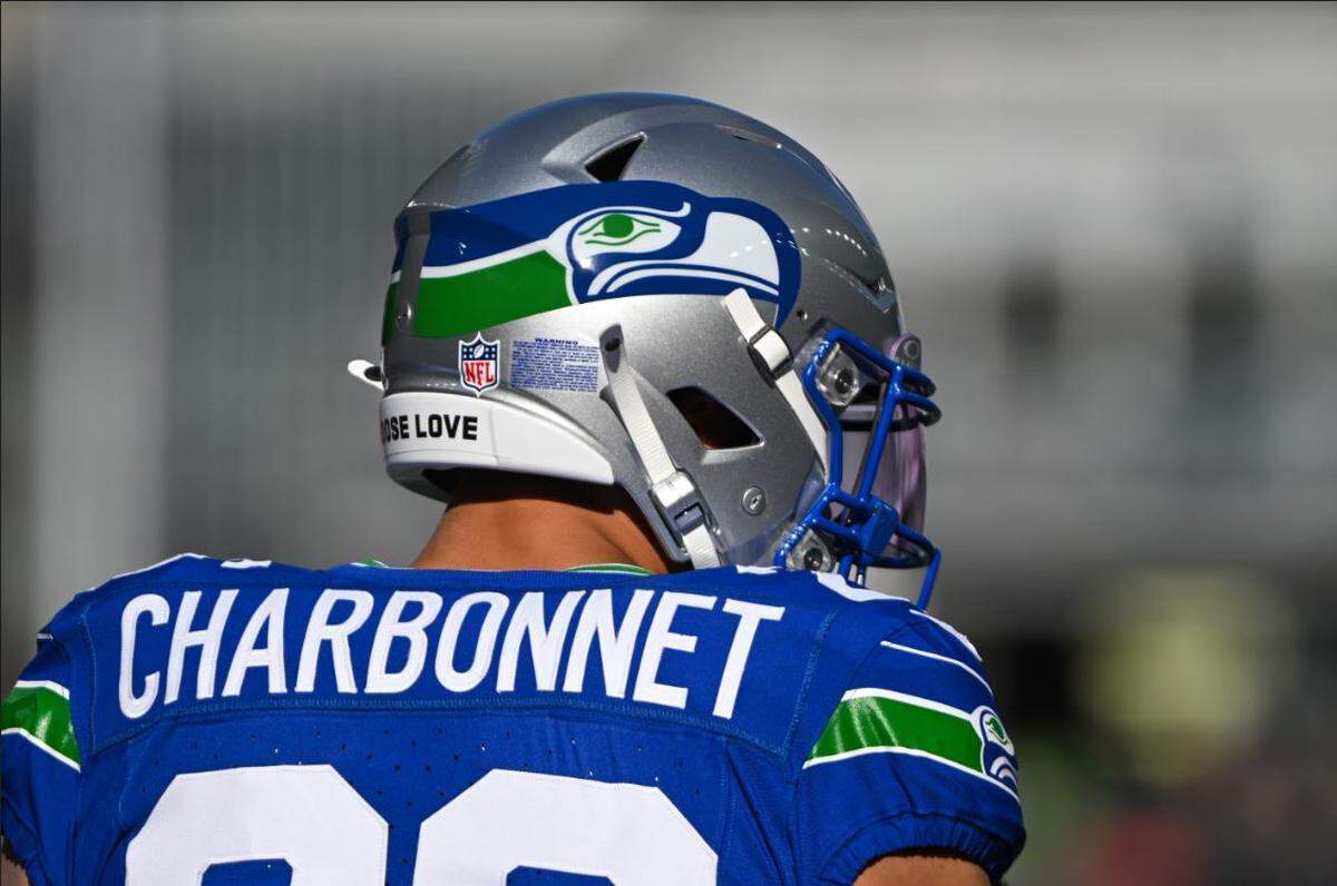 Seahawks running back Zach Charbonnet in the Kingdome-era throwback uniform Seattle wore for its home game against the Cleveland Browns Sunday, Oct. 29, 2023.