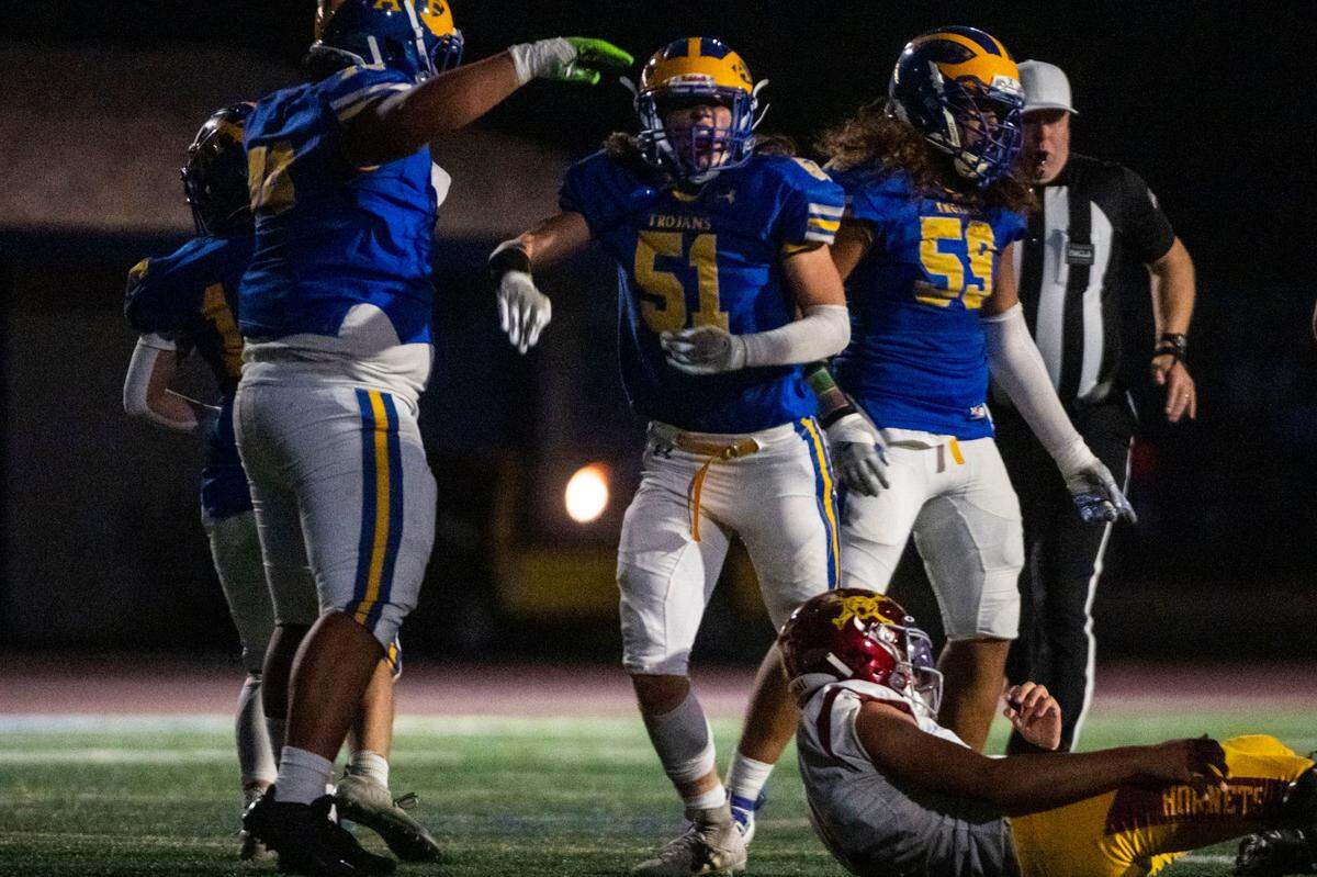 Fife’s Shea Sherman (51) celebrates after sacking and forcing a fumble by Enumclaw quarterback Gunnar Trachte which during the second quarter of 2A SPSL game on Thursday, Sept. 22, 2022, at Fife High School in Fife, Wash.
