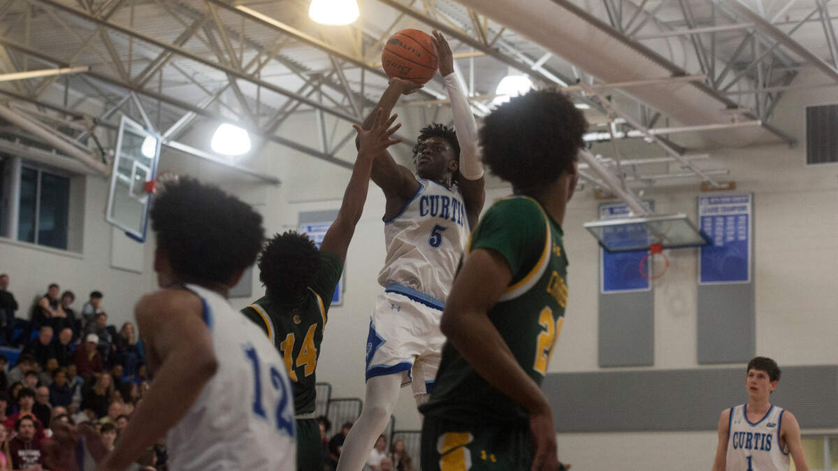 Curtis guard Zoom Diallo (5) shoots in the second quarter of a Class 4A West Central/Southwest district basketball game against Kentridge on Saturday, Feb. 11, 2023 at Curtis High School in University Place, Wash.