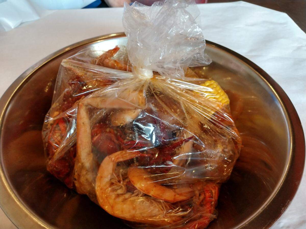 Seafood arrives heated in a bag at Boiling Crawfish.