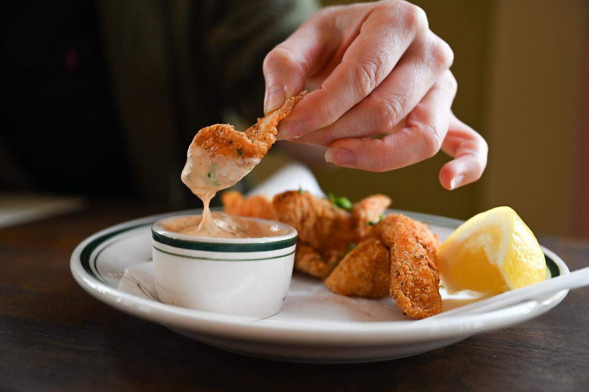 The fried catfish appetizer feels like a must-order, delicately breaded in spiced cornmeal to dip in an awesome Cajun tartar.