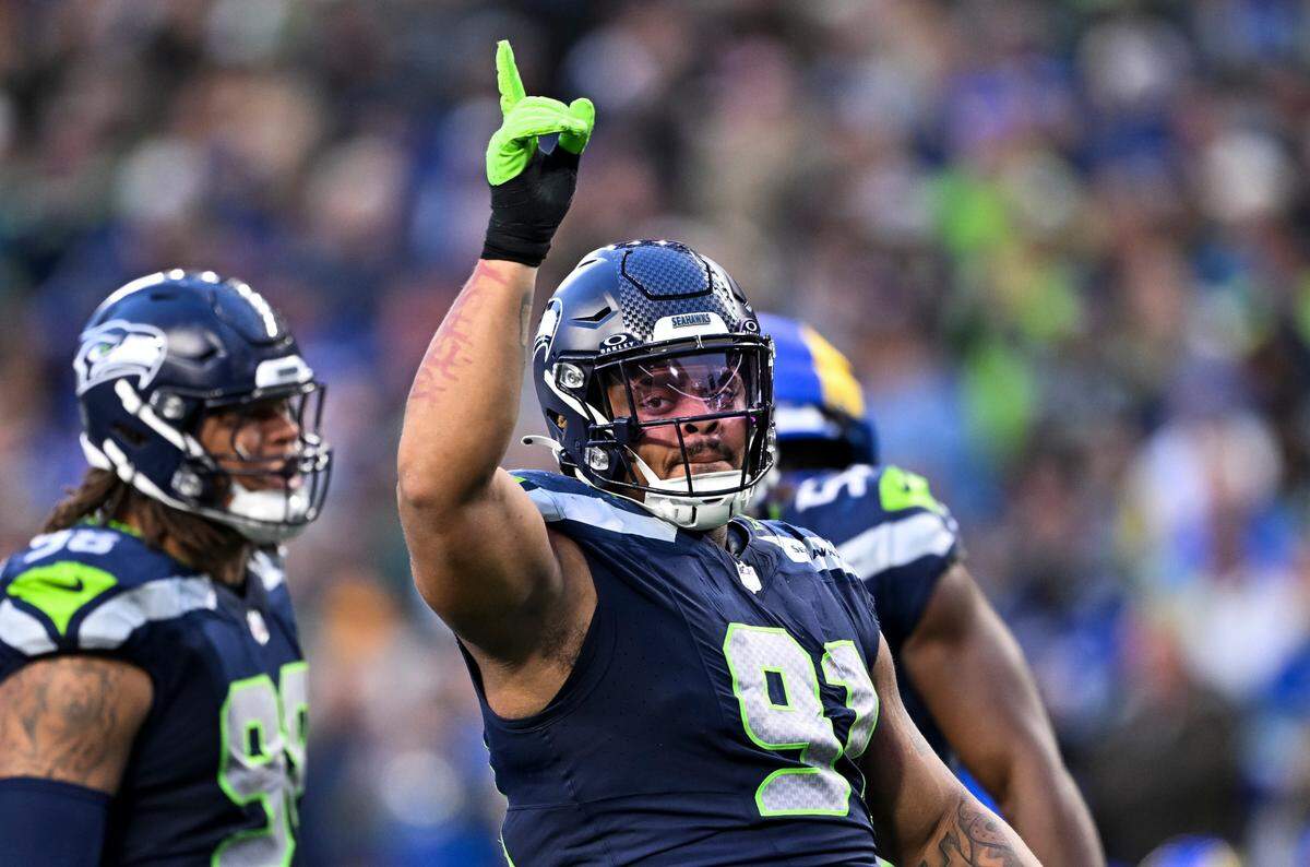 Seattle Seahawks defensive tackle Byron Murphy II (91) reacts to shutting down a run from Los Angeles Rams running back Kyren Williams (23) during the fourth quarter of the game at Lumen Field, on Sunday, Nov. 3, 2024 in Seattle, Wash.