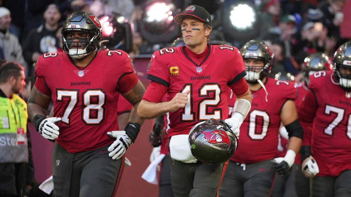Tampa Bay Buccaneers quarterback Tom Brady (12) runs onto the field before an NFL football game against the Seattle Seahawks, Sunday, Nov. 13, 2022, in Munich, Germany. (AP Photo/Matthias Schrader)