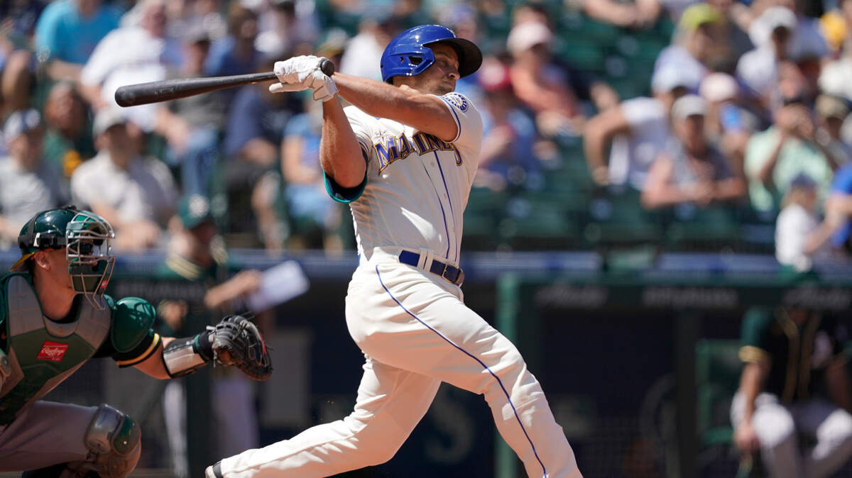 Seattle Mariners’ Kyle Seager hits a two-RBI single against the Oakland Athletics during the third inning of a baseball game, Sunday, July 25, 2021, in Seattle. (AP Photo/Ted S. Warren)