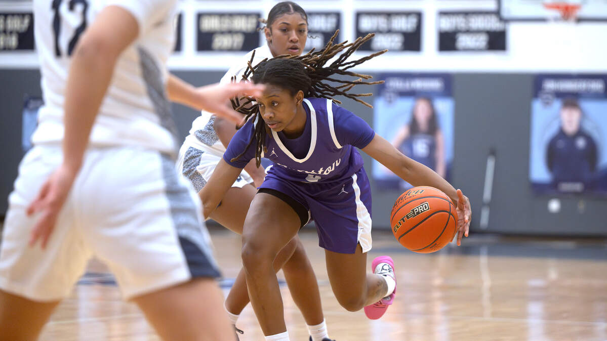 North Thurston’s Soraya Ogaldez drives the lane against Bellarmine defenders Alyssa Dawkins (12) and Kyla Frazier during Friday night’s girls basketball game at Bellarmine Preparatory School in Tacoma, Washington, on Jan. 17, 2025.