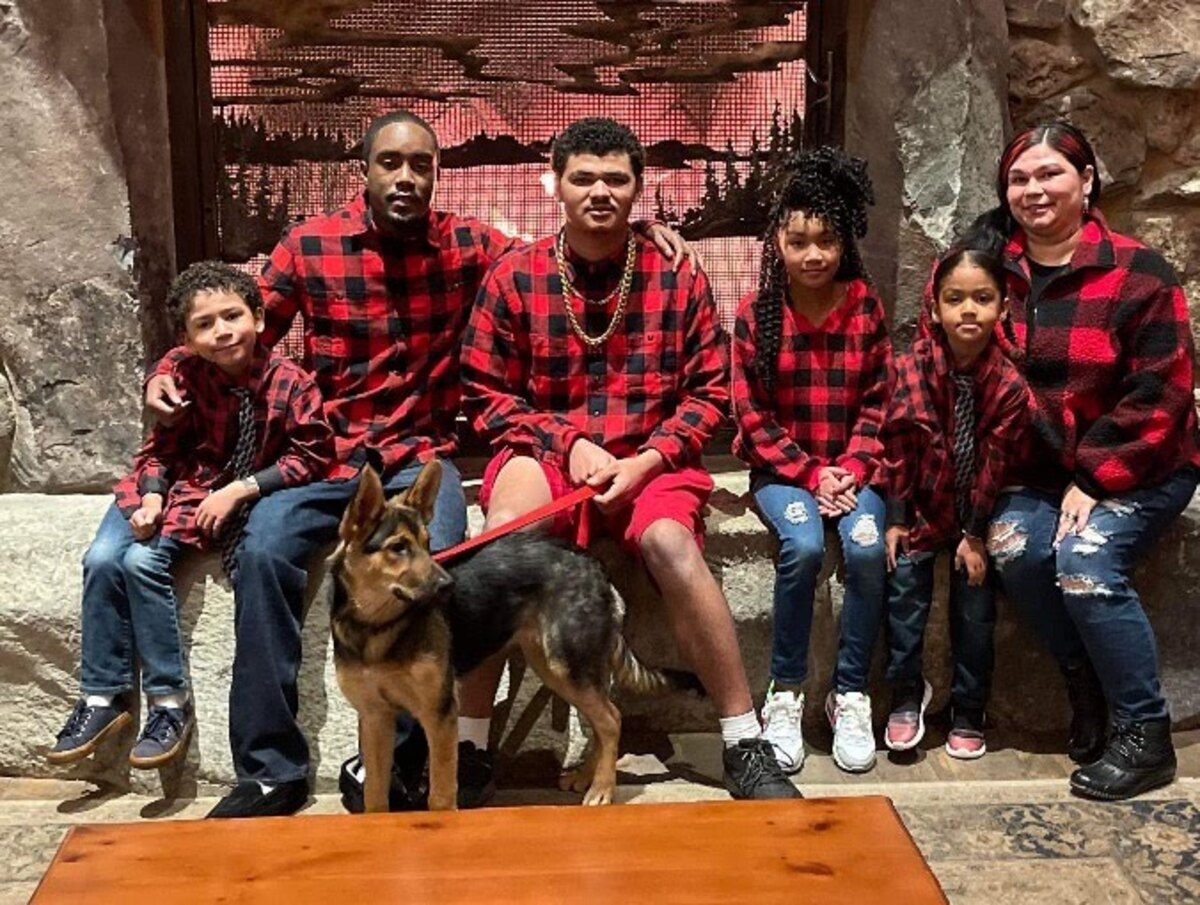 Regina Johnson, far right, and her family moved in July 2023 from a Pierce County Housing Authority-owed home in Spanaway to a private property, also in Spanaway, as the PCHA looks to sell its entire low-income public housing portfolio.