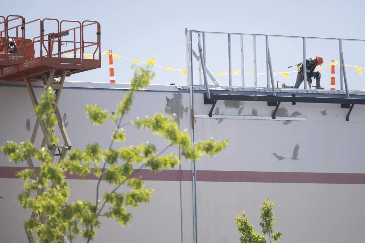 Work takes place at the former Tacoma Discount World on Thursday, May 21, 2026, in Lakewood.