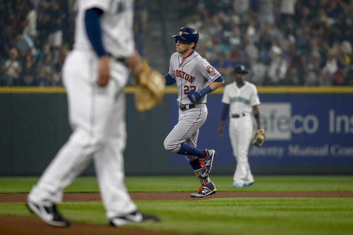Houston Astros’ Josh Reddick trots around the bases after hitting a solo home run off of Seattle Mariners pitcher Ross Detwiler during the fourth inning of a baseball game Tuesday, Aug. 21, 2018, in Seattle. (AP Photo/Jennifer Buchanan)