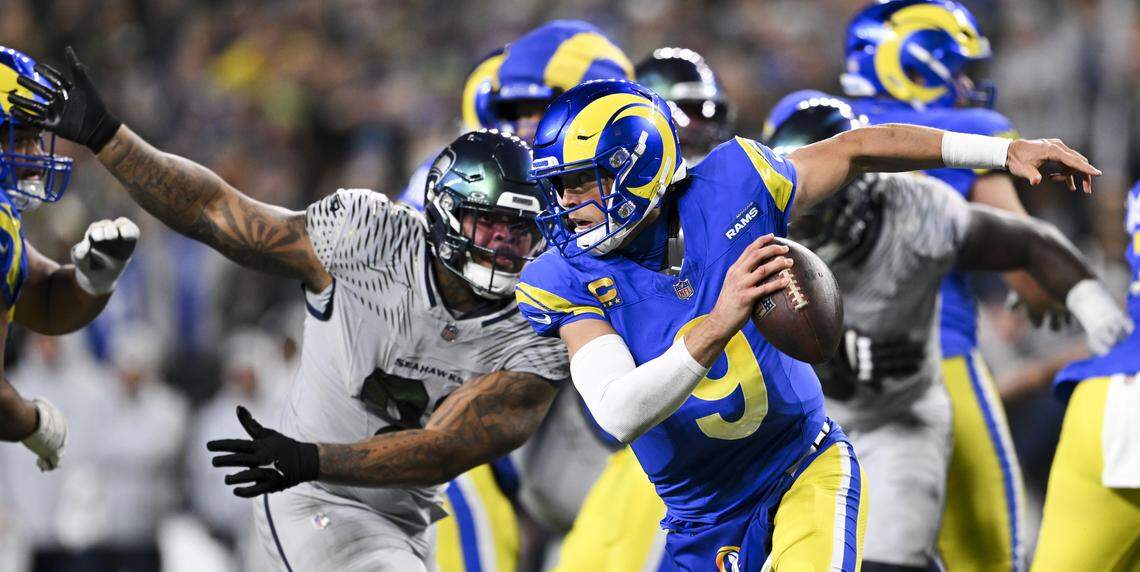 Los Angeles Rams quarterback Matthew Stafford (9) scrambles under pressure from Seattle Seahawks during the third quarter of the game at Lumen Field, on Thursday, Dec. 18, 2025, in Seattle.