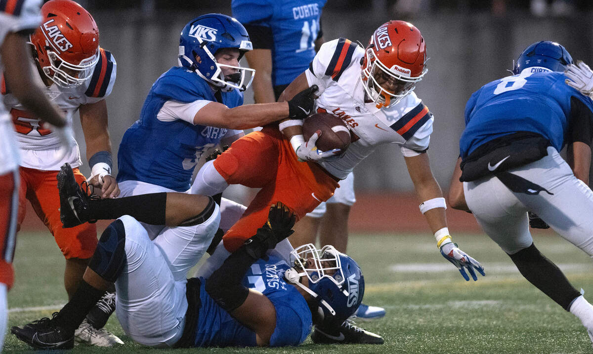 Lakes’ Sentoa Leapai is brought down during Friday night’s football game at Viking Stadium in University Place, Washington, on Sept. 20, 2024. After trailing 10-0, Lakes won the game, 14-10.