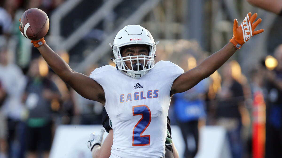 Graham Kapowsin receiver Malaki Roberson celebrates the Eagles first touchdown against  Sheldon at Sheldon High School.