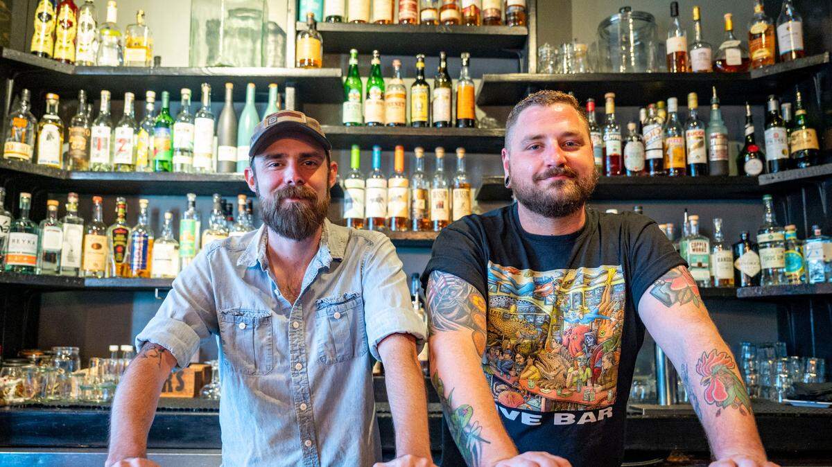 Riley Morgan (left), the new chef/owner of the bar at 1022 S. J St., in Hilltop, poses for a portrait along side bar manager Christopher Jennerjohn on Monday, Aug. 29, 2022, in Tacoma.