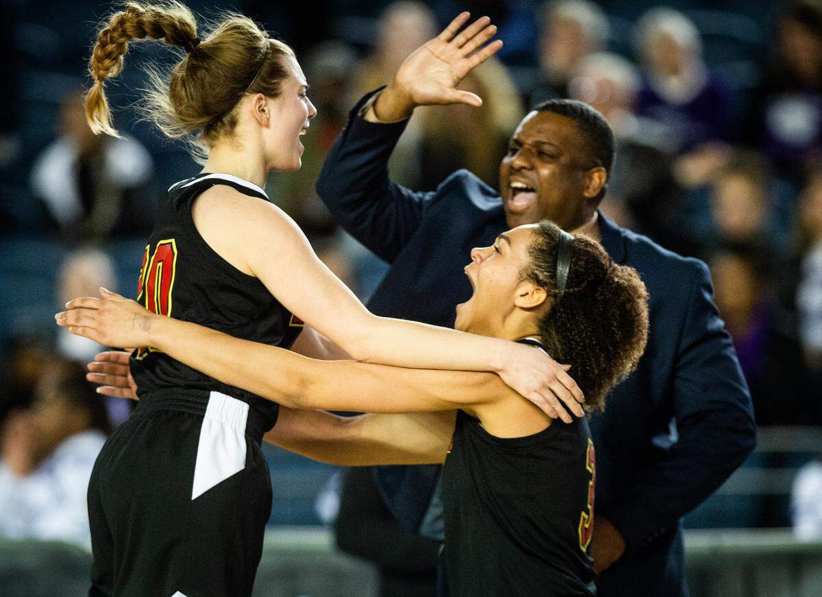 Kamiakin’s Rylie Clark (20) and Symone Brown (3) celebrate Kaimiakin’s win against Garfield. Garfield played Kamiakin in the 3A 3rd/5th place consolation game at the Hardwood Classic State Basketball Tournament at the Tacoma Dome in Tacoma, Wash., on Saturday, March 2, 2019.