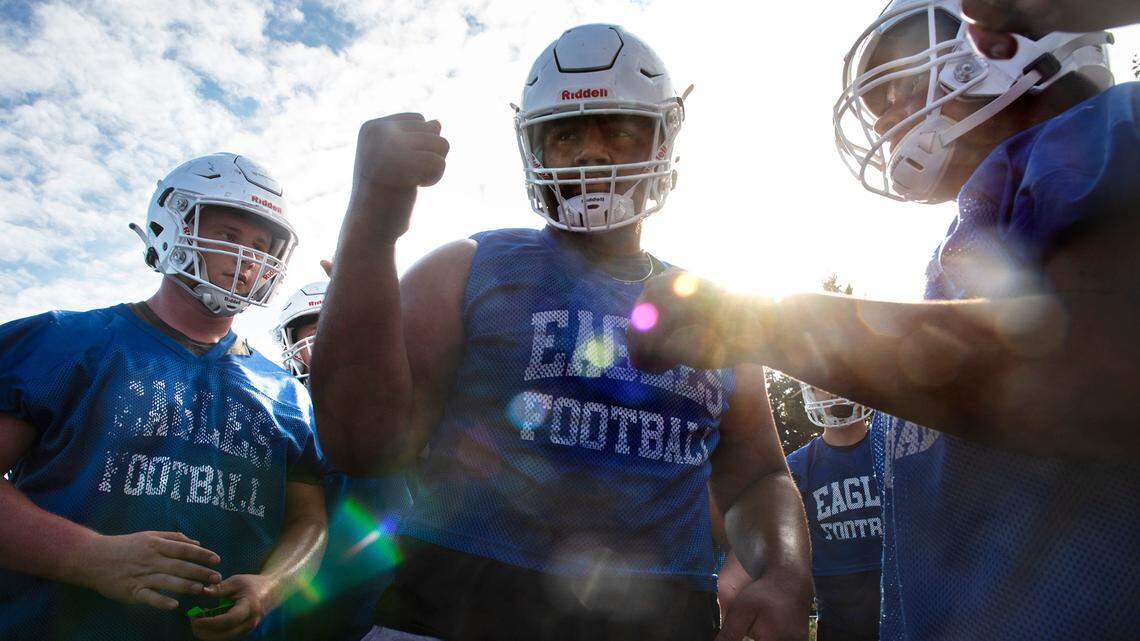 Graham-Kapowsin lineman Vega Ioane rallies the Eagles during football practice at Graham-Kapowsin High School in Graham, Washington, on Wednesday, Aug. 18, 2021.