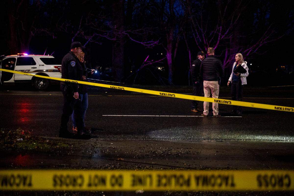 Detectives from the Tacoma Police Department investigate the scene of a shooting near the intersection of Portland Avenue and East 40th Street on Thursday, Jan. 12, 2023, in Tacoma.