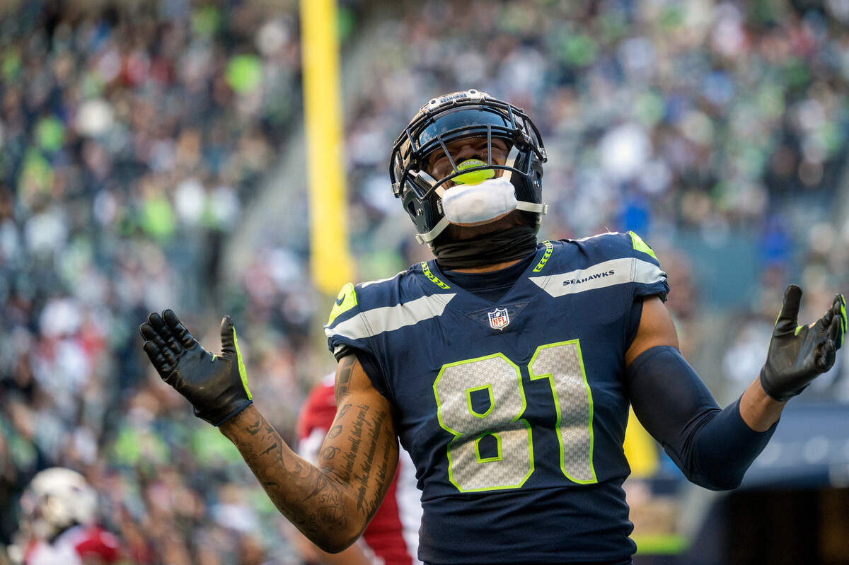 Seattle Seahawks tight end Gerald Everett (81) reacts after a pass to him by quarterback Russell Wilson (3) was overthrown in the endzone during the second quarter of an NFL game on Sunday afternoon at Lumen Field in Seattle.
