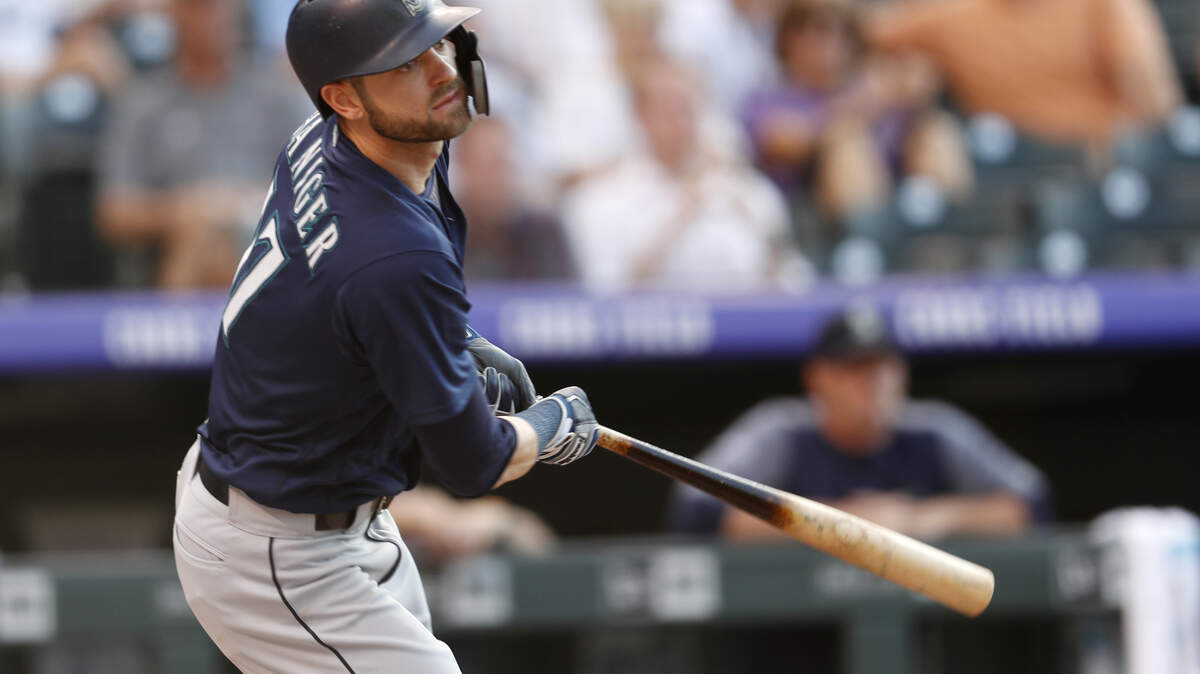 Seattle Mariners’ Mitch Haniger follows the flight of his RBI-single off Colorado Rockies starting pitcher Jeff Hoffman in the first inning of an interleague baseball game Friday, July 13, 2018, in Denver. (AP Photo/David Zalubowski)