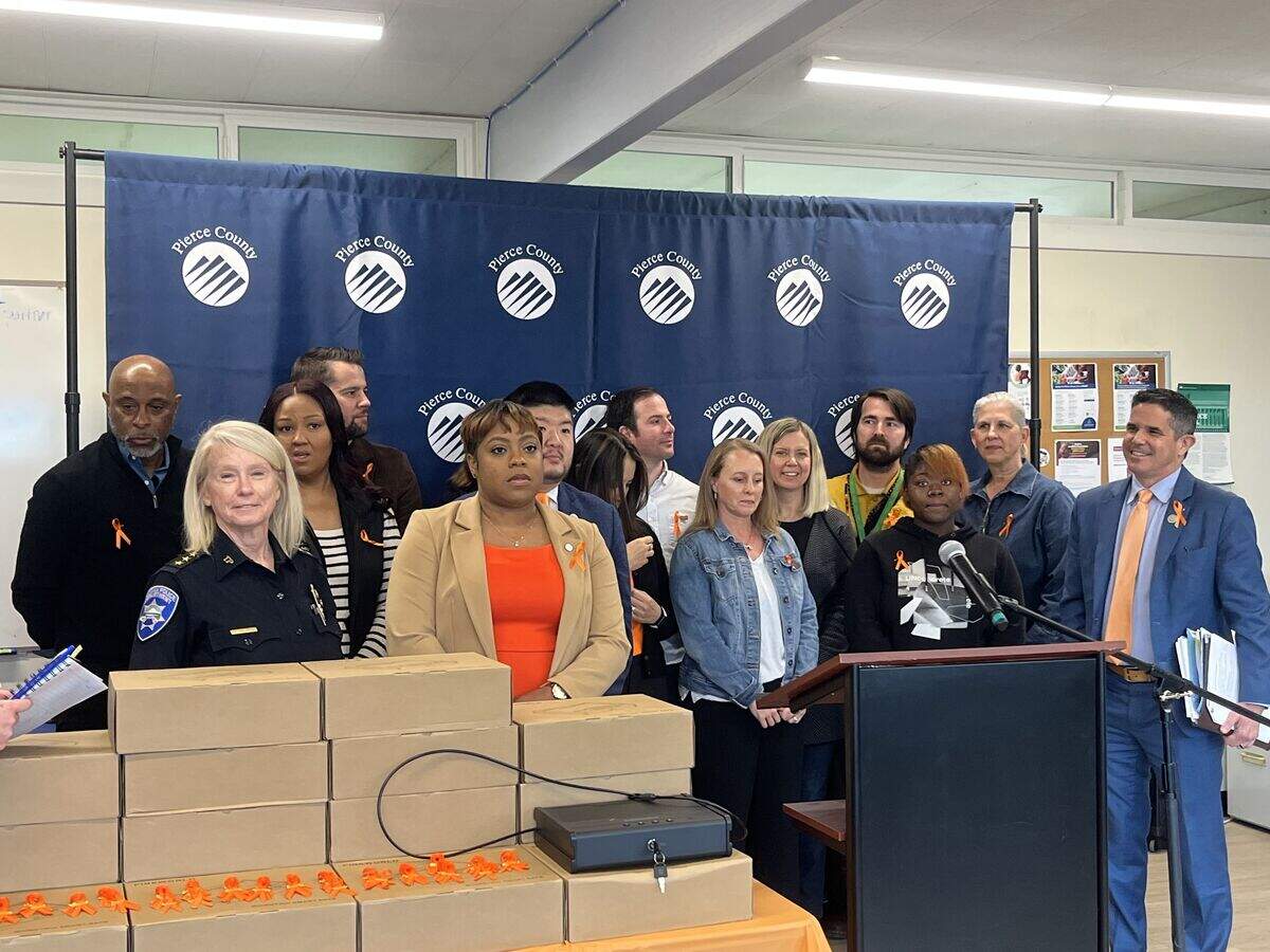 Local elected officials and community leaders gather at the Eastside Family Resource Center June 8, 2026 to announce new funding for gun lockboxes.