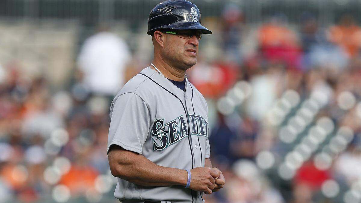 Seattle Mariners third base coach Manny Acta watches against the Detroit Tigers in the first inning of a baseball game in Detroit, Monday, June 20, 2016. (AP Photo/Paul Sancya)