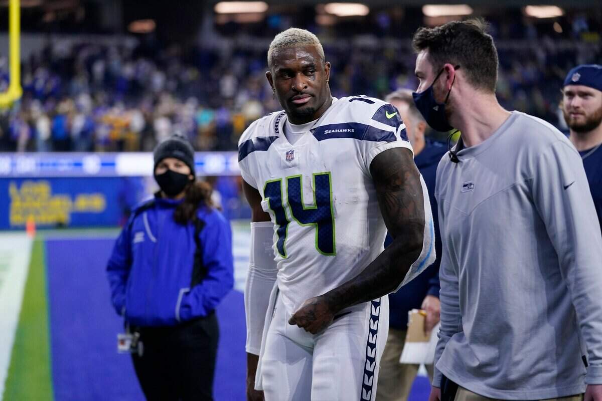 Seattle Seahawks wide receiver DK Metcalf (14) walks off the field after a loss to the Los Angeles Rams during an NFL football game Tuesday, Dec. 21, 2021, in Inglewood, Calif. (AP Photo/Ashley Landis)