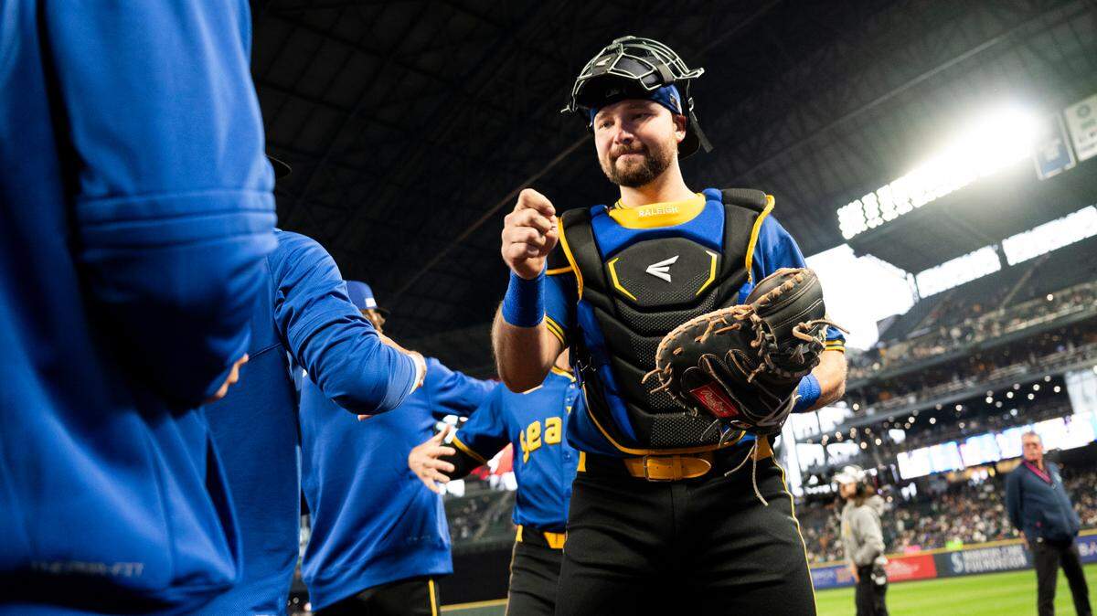 Seattle Mariners catcher Cal Raleigh (29) greets teammates before the game against the Texas Rangers at T-Mobile Park, on Friday, June 14, 2024, in Seattle.