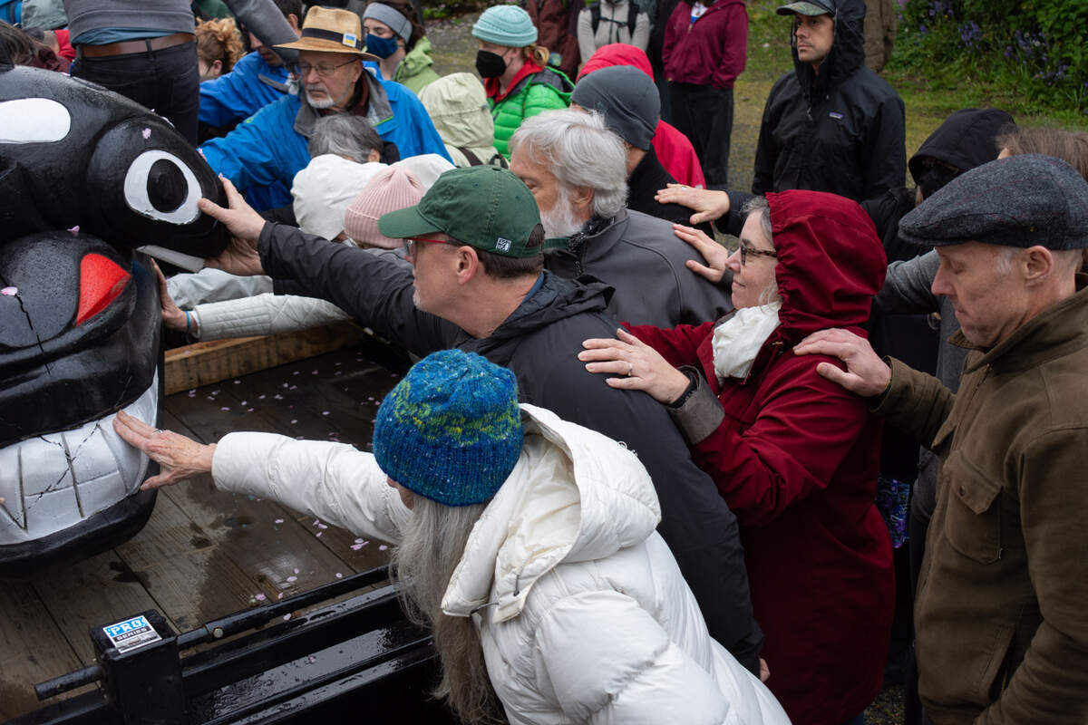 The Bellingham community gathers to bless the House of Tears Carvers’ totem pole updated for The Snake River to Salish Sea Spirit of the Waters totem pole journey at its launch Tuesday, May 3, at Bellingham Unitarian Fellowship. The 2,300-mile journey highlights the vital role of the Snake River, salmon and orca to the lifeways and identities of Tribal communities in the region.