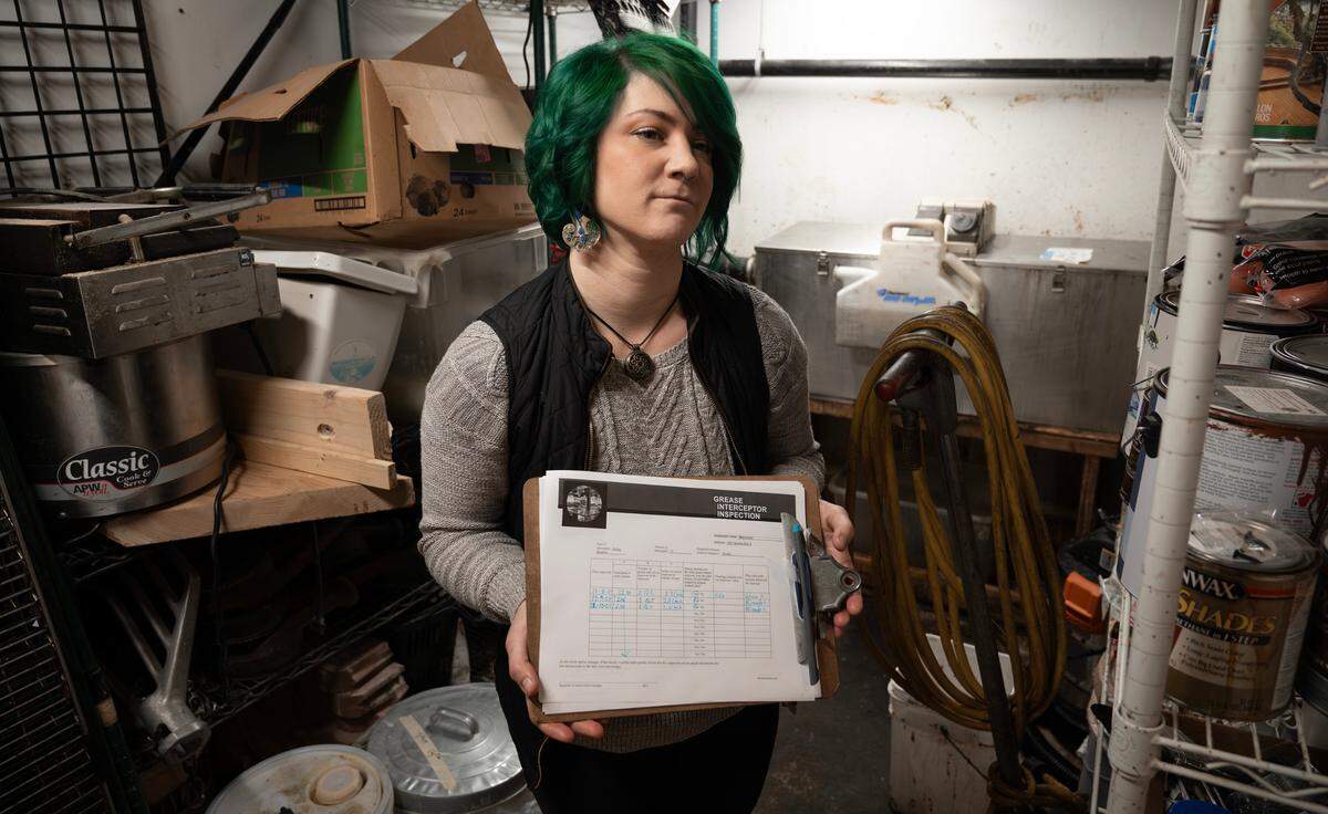 Eda Johnson and her landlord pushed back against the City of Tacoma’s demand to install an in-ground grease interceptor at Manuscript and Dialogue. She agreed to a cleaning regimen that she was told would be reviewed after a few months, but no one from the city has ever followed up.