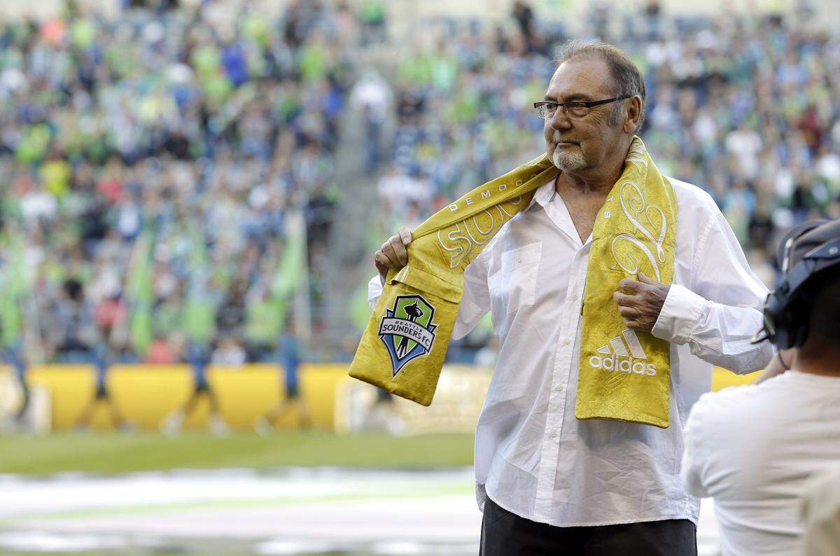 John Best, former coach and general manager of the North American Soccer League Seattle Sounders, receives the “Golden Scarf” honor prior to an MLS soccer match between the Seattle Sounders and Vancouver Whitecaps, Saturday, June 8, 2013, in Seattle.