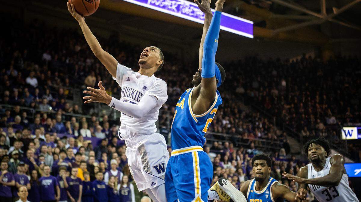 Washington Huskies guard Quade Green (55) puts up a shot around UCLA Bruins guard Prince Ali (23) during the second half. The Washington Huskies played the UCLA Bruins in a NCAA basketball game at Hec Edmundson Pavilion in Seattle, Wash., on Thursday, Jan. 2, 2020.