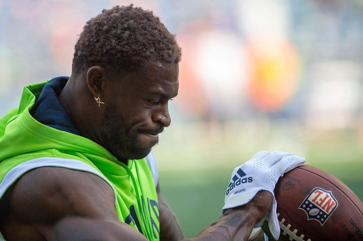 Seattle Seahawks wide receiver DK Metcalf catches passes prior to the start an NFL game against the Denver Broncos on Monday, Sept. 12, 2022, at Lumen Field in Seattle.
