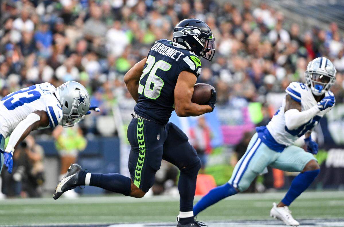 Seattle Seahawks running back Zach Charbonnet (26) breaks away for a big run during the first quarter of the preseason game against the Dallas Cowboys at Lumen Field, Saturday, Aug. 19, 2023, in Seattle, Wash.