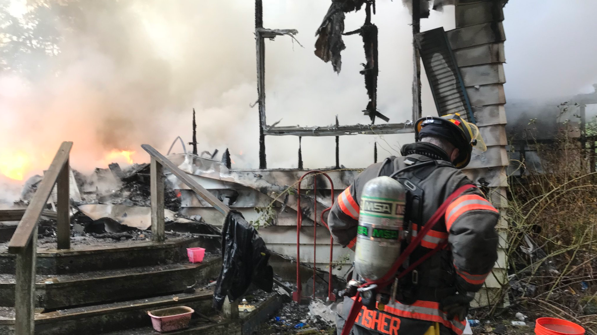 A double wide mobile home and an attached dwelling were a complete loss after a fire Saturday afternoon near Key Center.