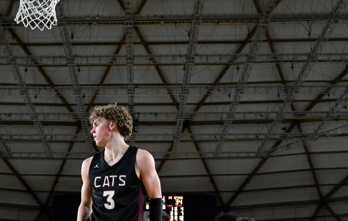 Mt. Spokane’s Ryan Lafferty (3) defends under the basket during the semifinals game of the Class 3A state tournament at the Tacoma Dome, on Friday, March 1, 2024, in Tacoma, Wash.